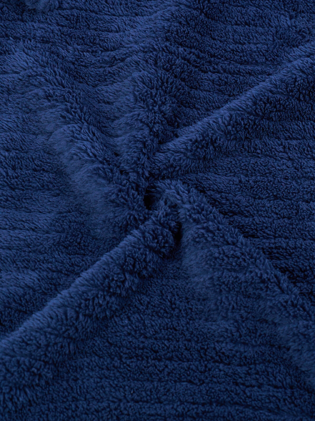 Man wearing a comfortable men's winter fleece bathrobe, ideal warm morning robe for relaxation.