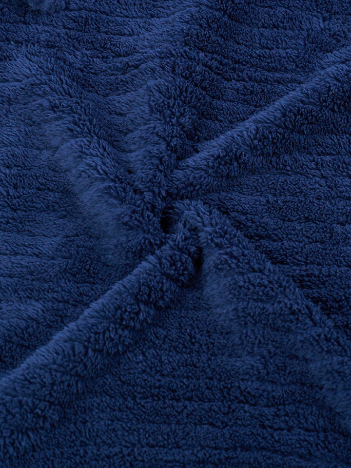 Man wearing a comfortable men's winter fleece bathrobe, ideal warm morning robe for relaxation.