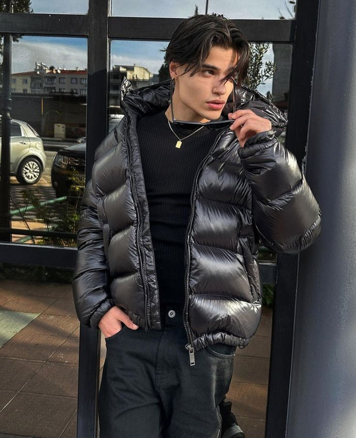 Stylish men's glossy black puffer jacket. Fashionable winter outerwear, perfect for everyday casual wear.