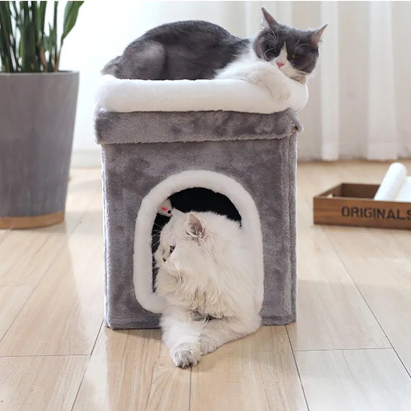 Feline pet comfort: collapsible cat cave bed with soft interior and dangling toy, a cozy pet supply.