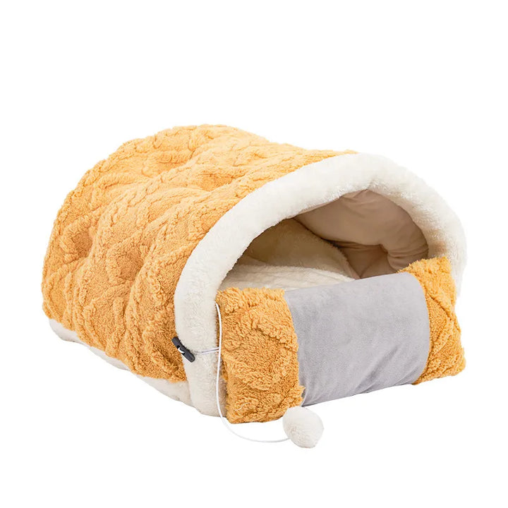 Luxury cat bed for napping, featuring a soft cushion & playful toy. Essential pet supplies for feline comfort.