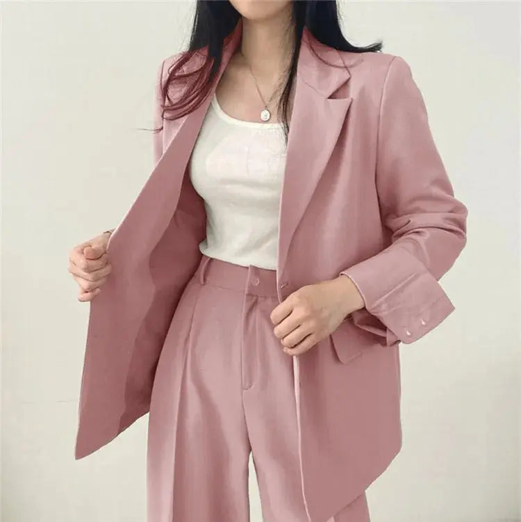 Chic women's two-piece suit, tailored for office wear and professional elegance.