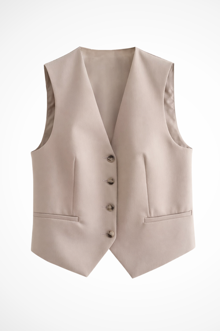 Chic tailored women's beige suit featuring a sleeveless waistcoat and sophisticated straight-leg trousers for elegance.