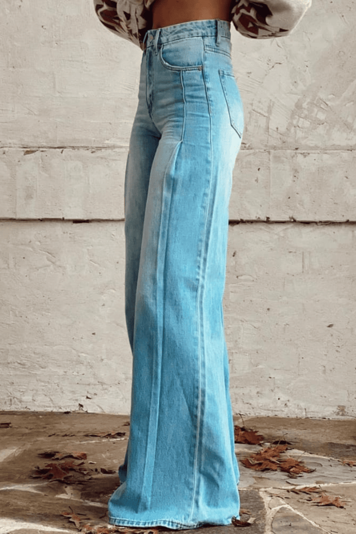 Flowy high-waist blue bohemian wide leg pants for women, ideal for comfortable casual wear and trendy summer outfits.
