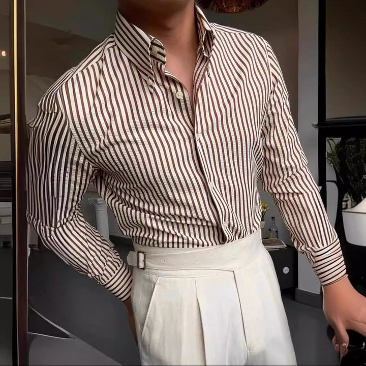 Classic men's striped long sleeve dress shirt. Button-down style, versatile for office attire or smart casual men's fashion.