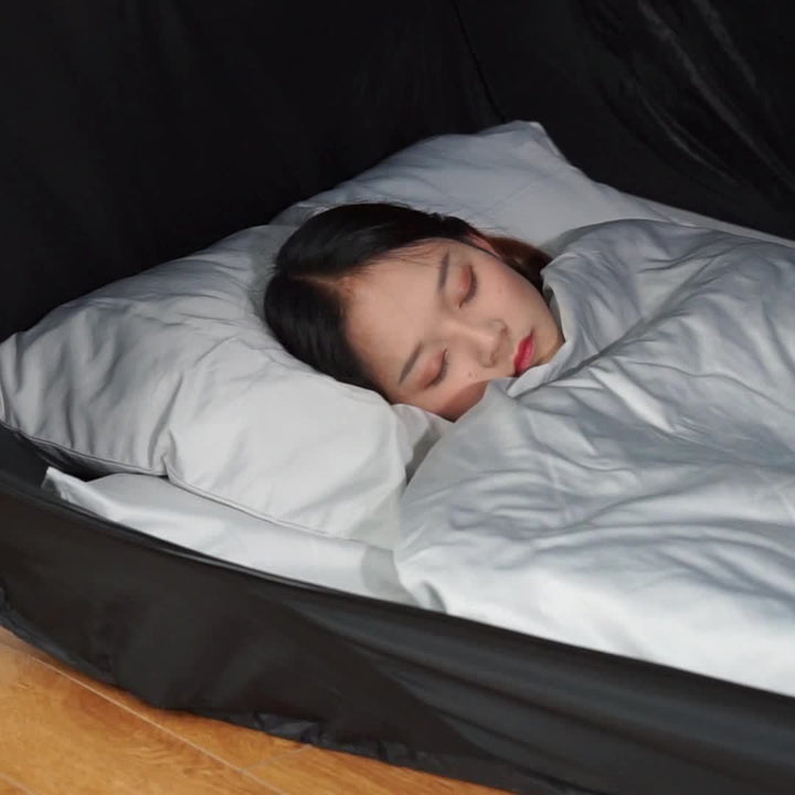 Versatile black portable tent bed. Foldable for easy transport, perfect for private sleep at camp or home.