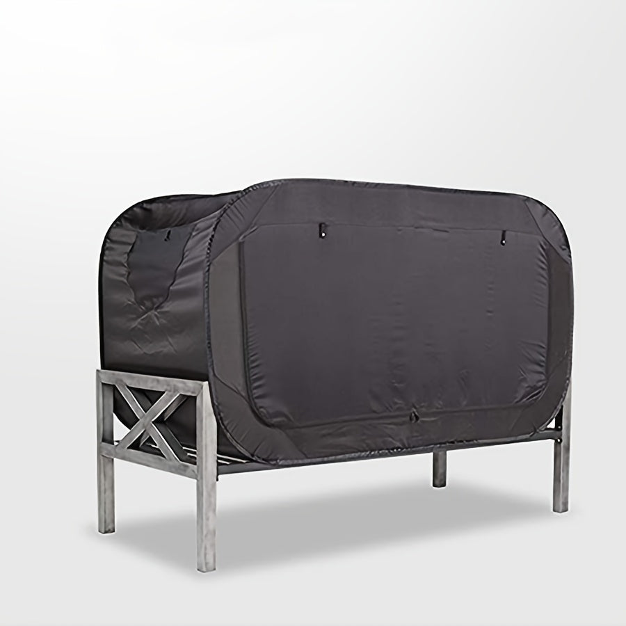 Compact black folding tent bed, ideal for private sleep during camping, travel, or as an indoor extra bed.