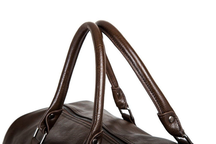 Brown duffel bag, durable construction. Perfect carry-on or weekend bag.