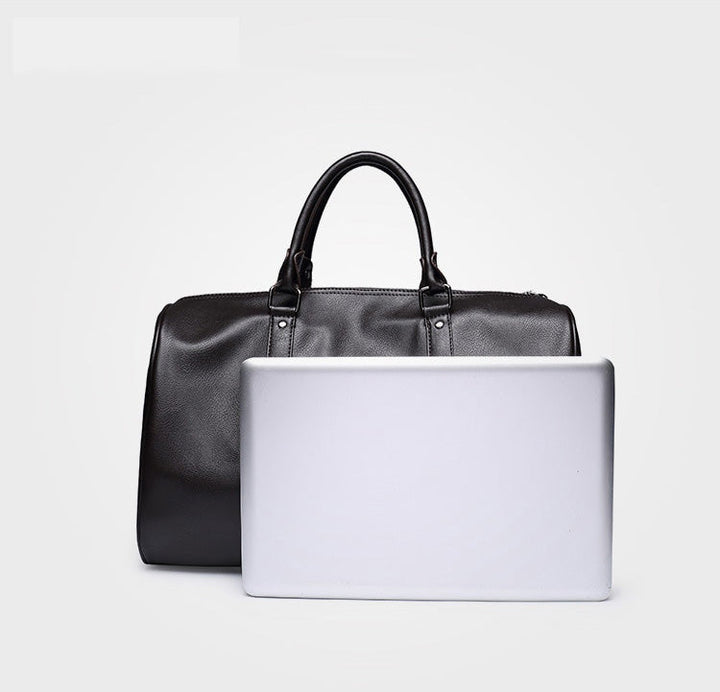 Brown leather-look travel duffel bag for men. Spacious, stylish luggage for your next adventure.