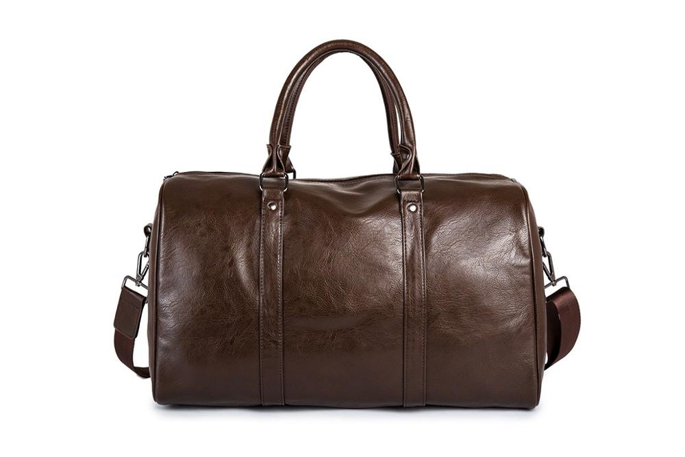 Black travel duffel bag with dual handles. Versatile, essential luggage for any traveler.