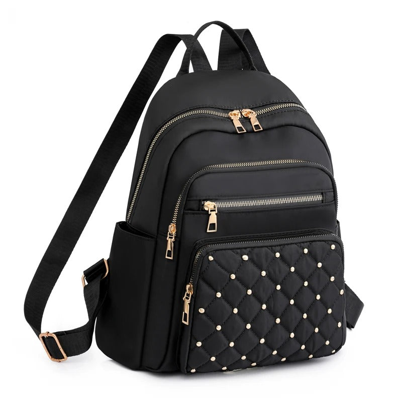 Black lightweight water-resistant nylon backpack for women, ideal for travel, school, or daily commute.