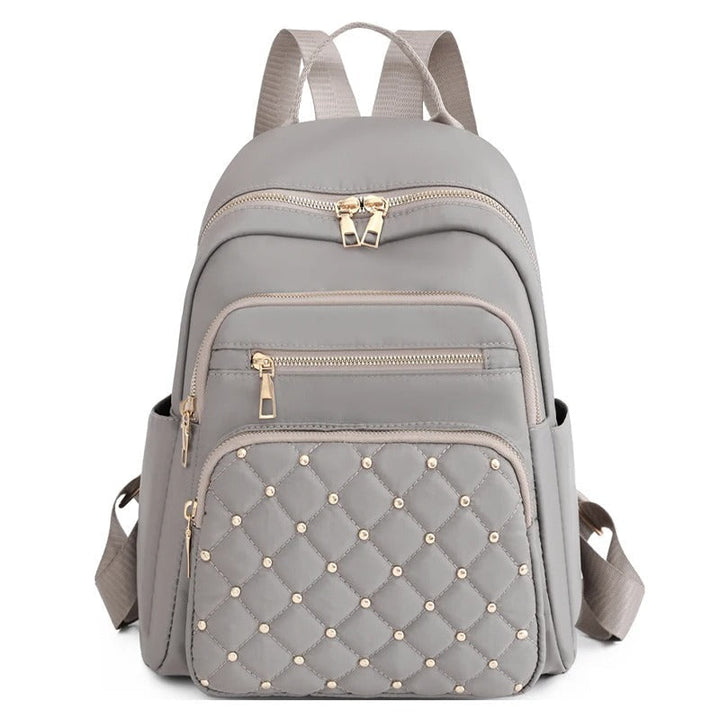 Versatile women's travel backpack; lightweight, water-resistant nylon makes it perfect for adventures.