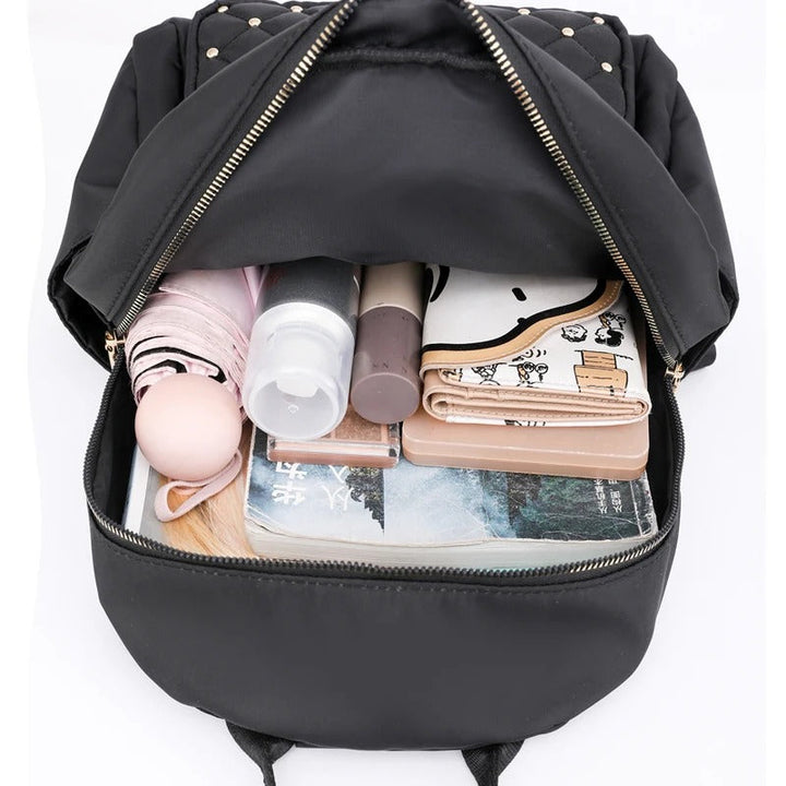 High-quality water-resistant nylon women's backpack, lightweight and durable for school, travel, or commute.
