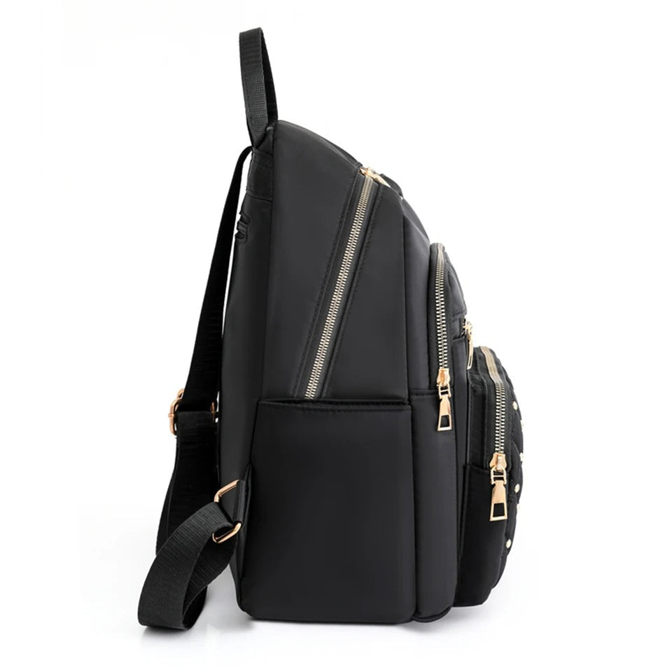 Chic black women's nylon backpack, lightweight and water-resistant for a practical & stylish daily commute.
