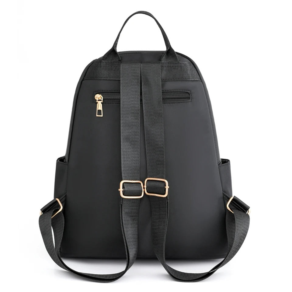 Comfortable, lightweight women's backpack in water-resistant nylon, versatile for travel, school, daily use.