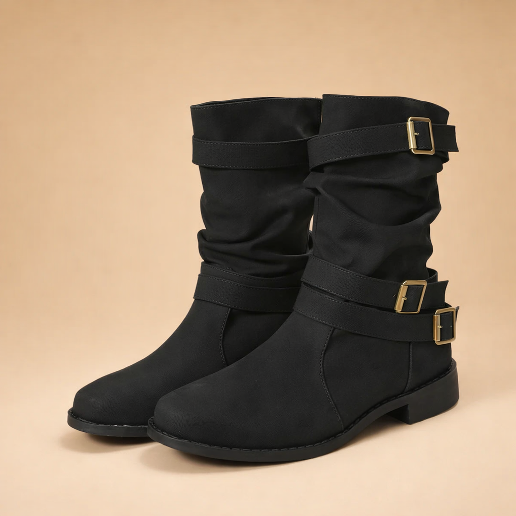Women's stylish mid-calf boots with buckle straps. Chic, comfortable winter footwear for a fashionable look.