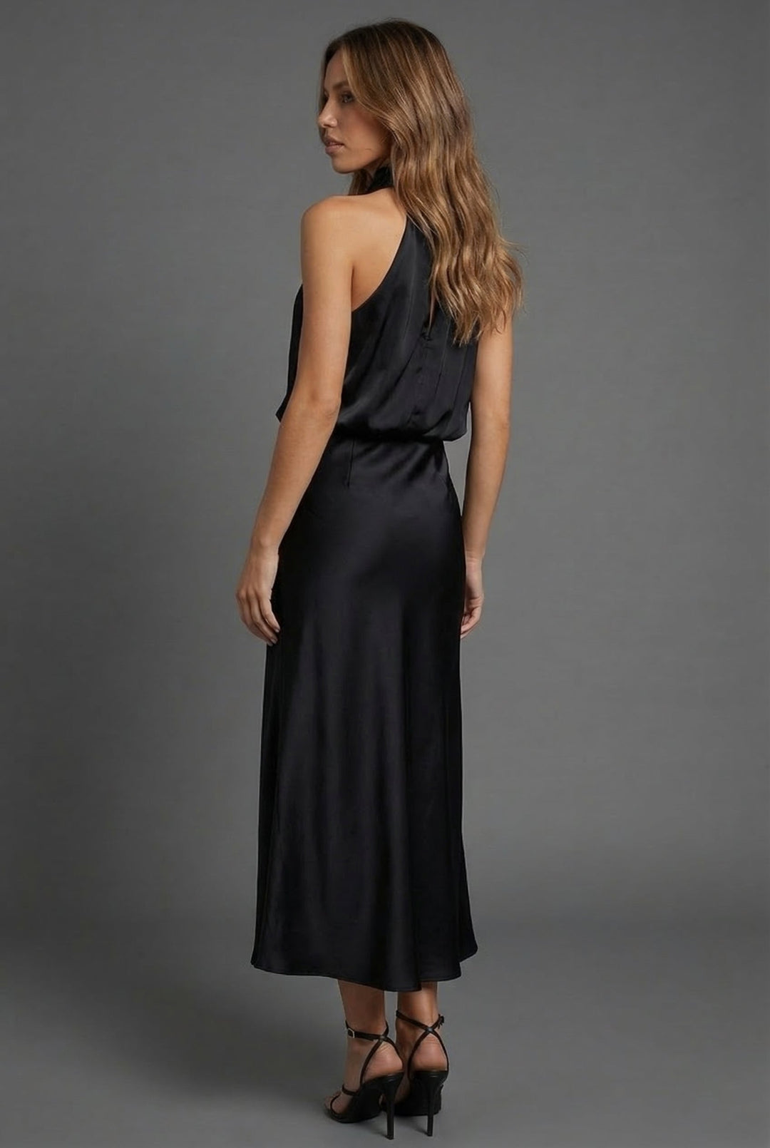 Stylish women's summer cocktail dress, halter neck and midi length.