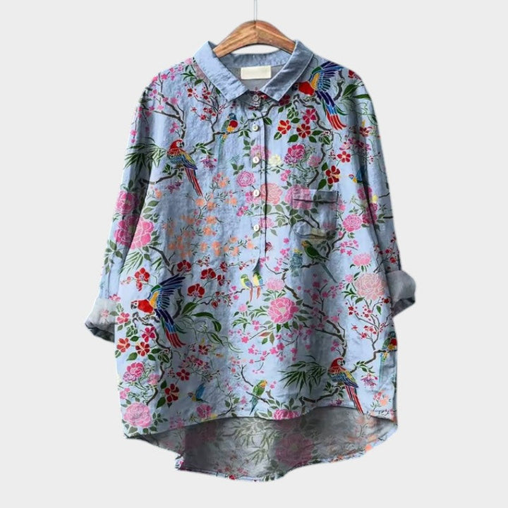 Stylish women's button-front blouse with long sleeves, perfect for elegant office wear or casual everyday fashion.