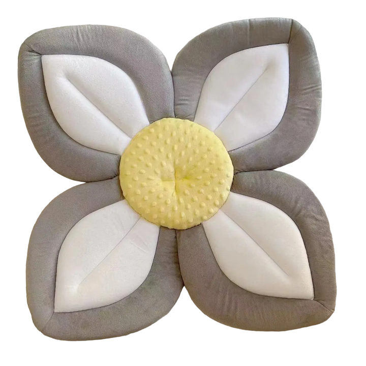 Blooming flower baby bath seat in a sink, soft plush support for comfy infant bathing.