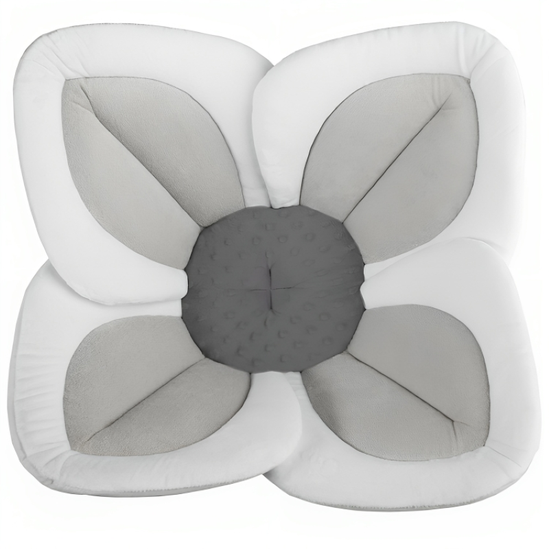 Soft blooming baby bath seat for sink, machine washable plush flower offers safe infant bathing.