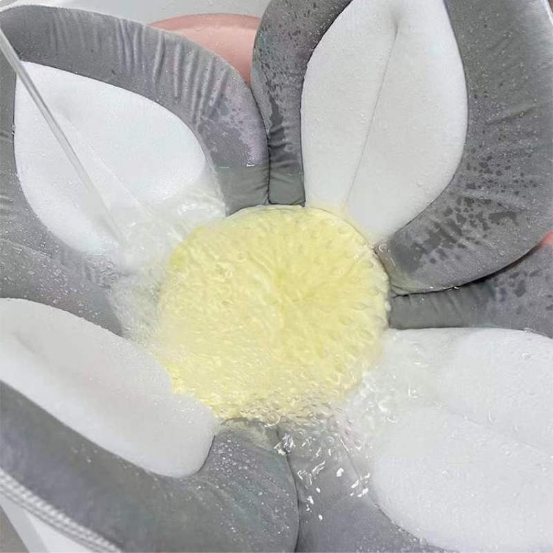 Baby's blooming sink bath seat, non-slip plush flower cushion for secure & comfy newborn care.