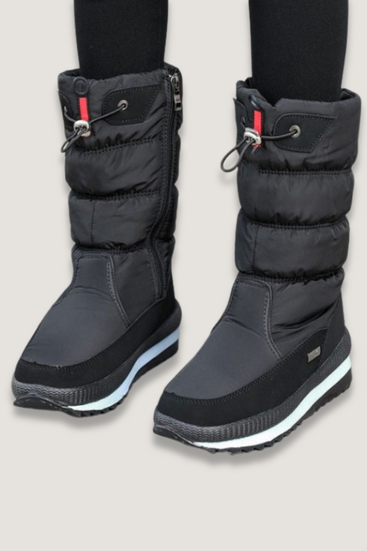 Women's waterproof snow boots with non-slip sole for winter comfort. Warm, weatherproof outdoor footwear.