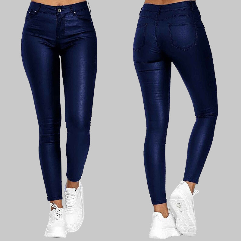 Unisex slim fit high-waisted pants with sleek finish & stretchy fabric. Versatile for casual or evening wear.