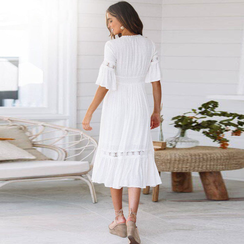 Stylish women's white midi dress with V-neck, lace trim, flutter sleeves. A versatile boho summer dress for any occasion.