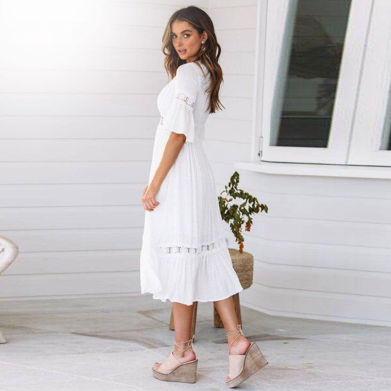Boho white midi dress for women featuring a V-neck, flutter sleeves & tiered design. Ideal for summer and spring fashion.