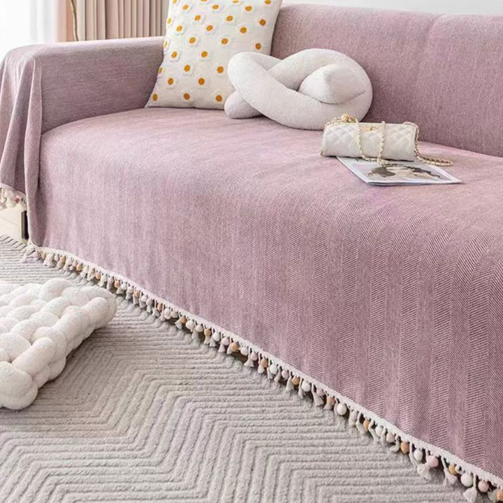 Boho style pet-friendly sofa cover with herringbone pattern and tassels, ideal for stylish protection in living rooms.
