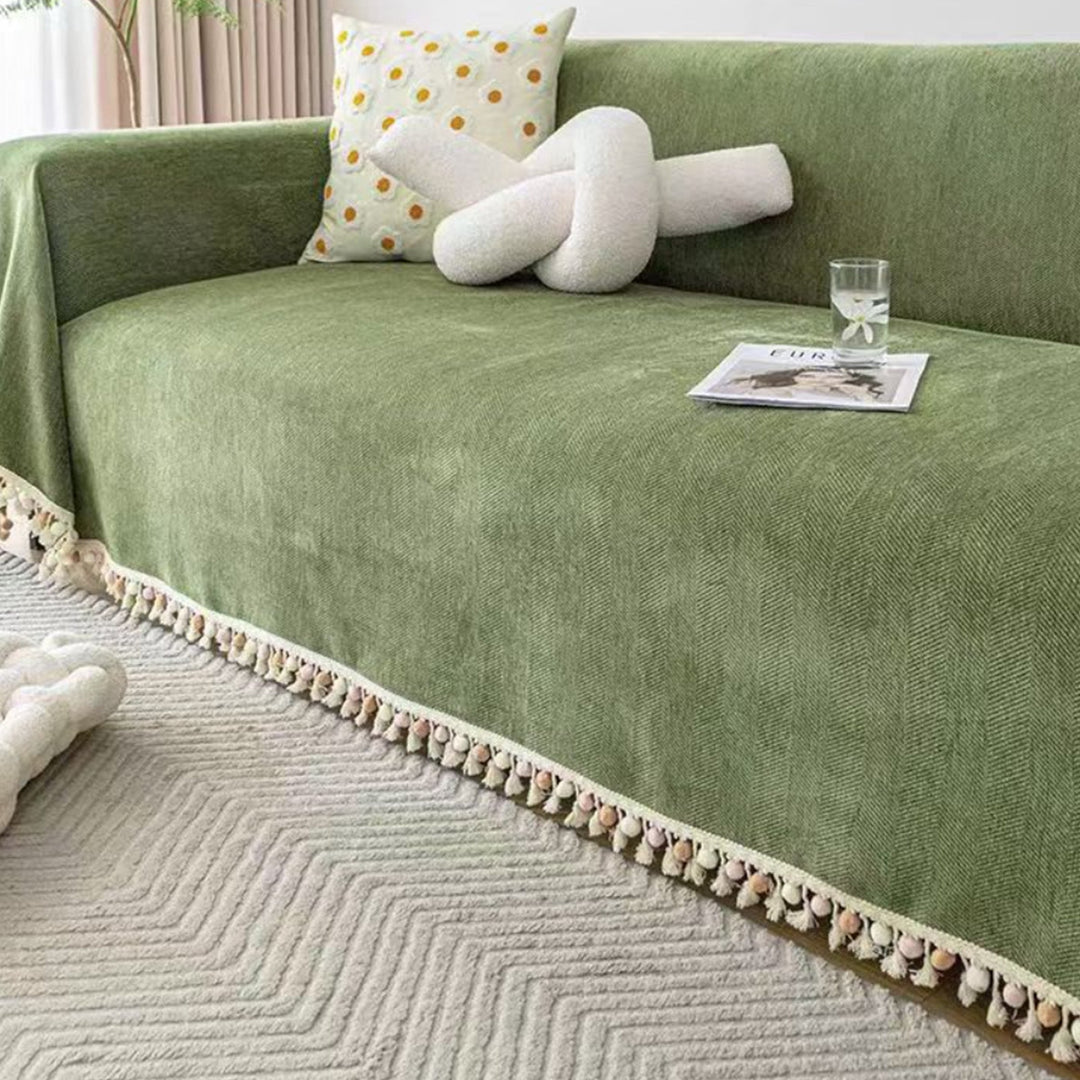 Boho style pet-friendly sofa cover with herringbone pattern and tassels, ideal for stylish protection in living rooms.