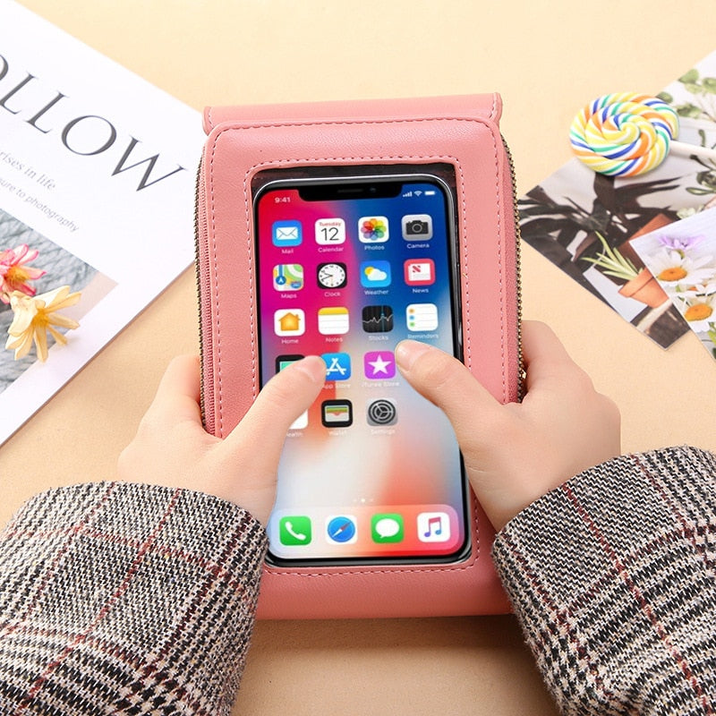 Women's elegant PU leather shoulder bag with clear touchscreen access for smartphones.
