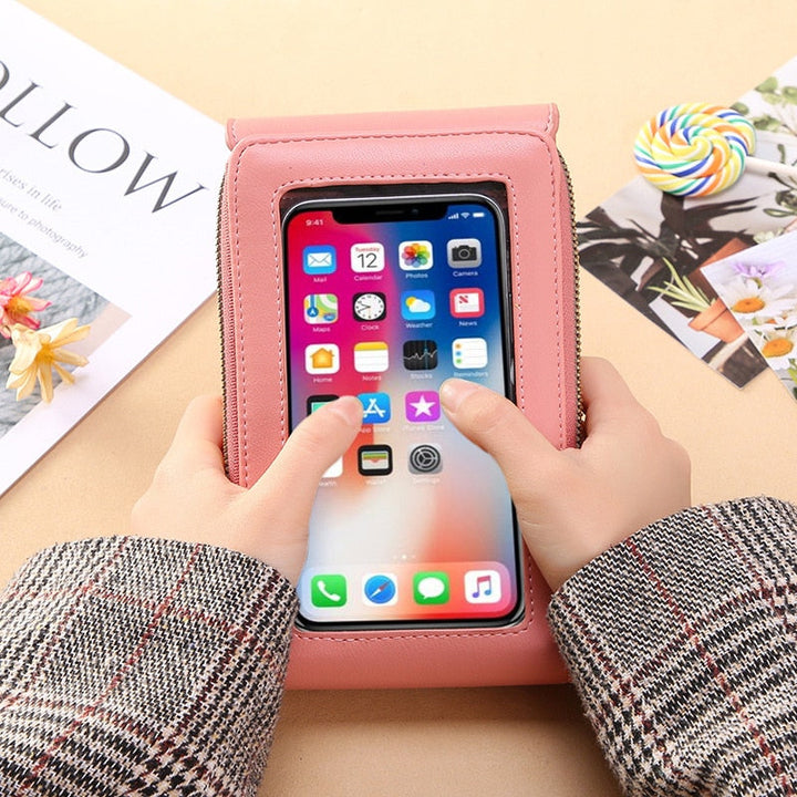 Women's elegant PU leather shoulder bag with clear touchscreen access for smartphones.