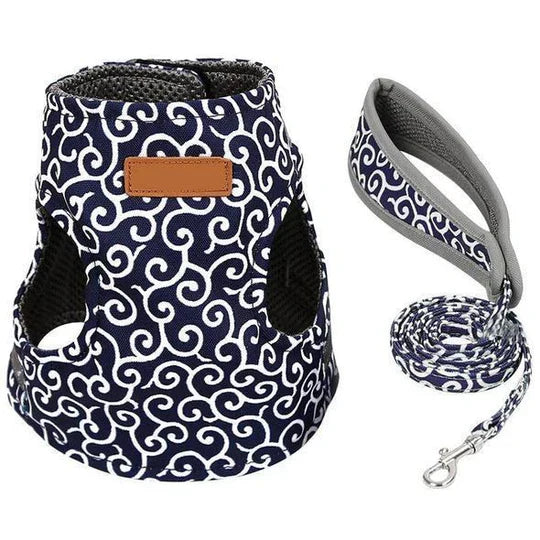 Lightweight breathable cat harness with adjustable straps and leash for felines.