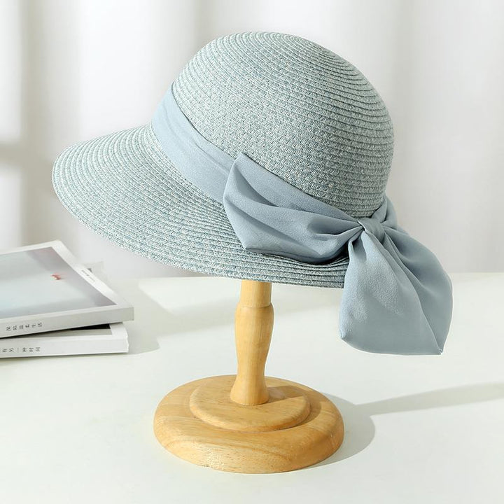 Breathable wide brim straw sun hat for women, a must-have elegant accessory for summer and travel.