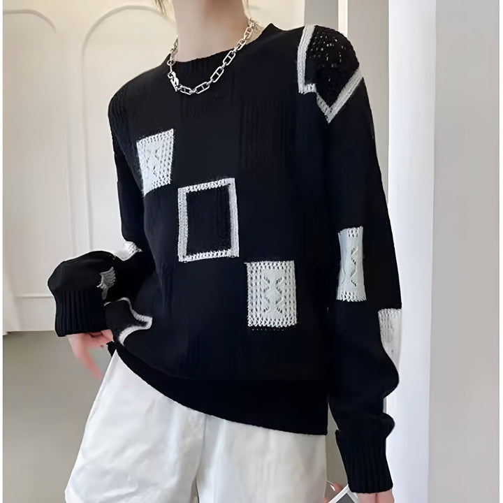 Elegant women's knit pullover sweater, ideal winter wear. Cozy long sleeve top for stylish comfort and chic look.