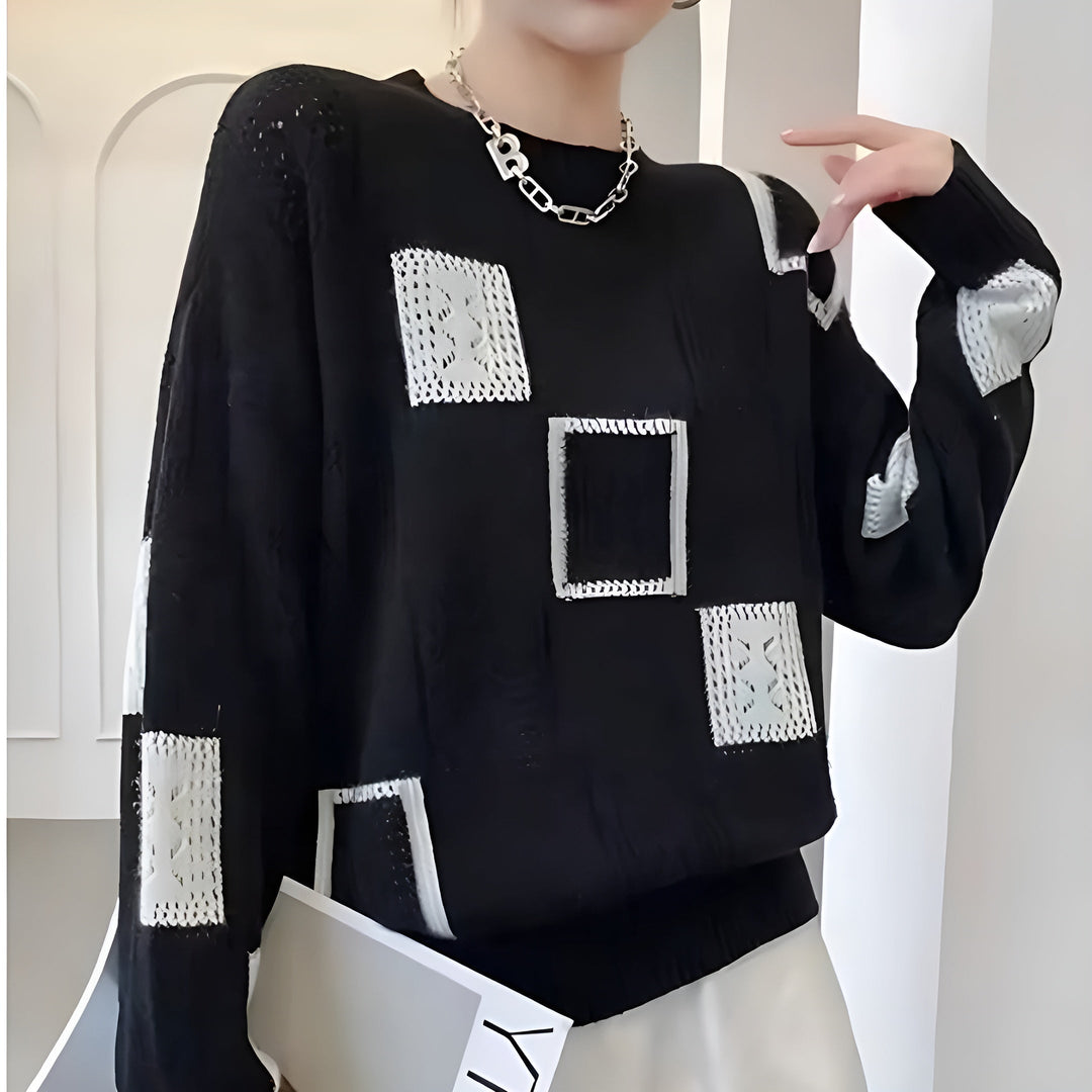 Women's chic knit pullover sweater, featuring cozy comfort and elegant style. Soft long sleeve round neck for winter.