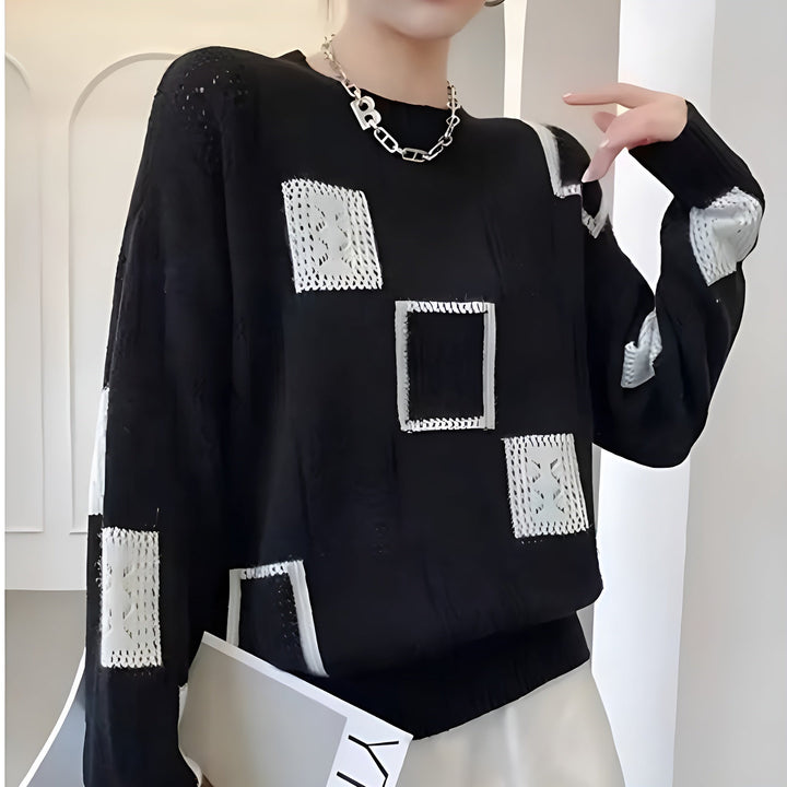 Women's chic knit pullover sweater, featuring cozy comfort and elegant style. Soft long sleeve round neck for winter.