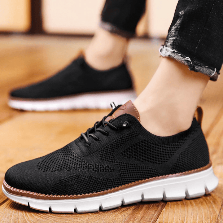 Perforated men's sneakers, ideal for casual wear, featuring a comfortable lace-up design.
