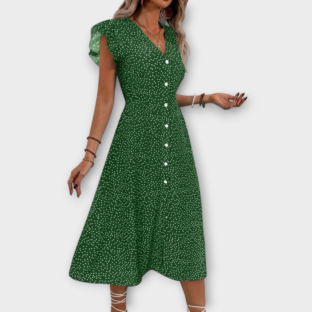 Midi length A-line polka dot dress for women, combining elegance and comfort for spring & summer.