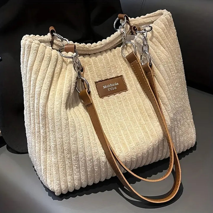 Elegant corduroy handbag, a chic women's shoulder bag ideal for stylish everyday carry and fashion.