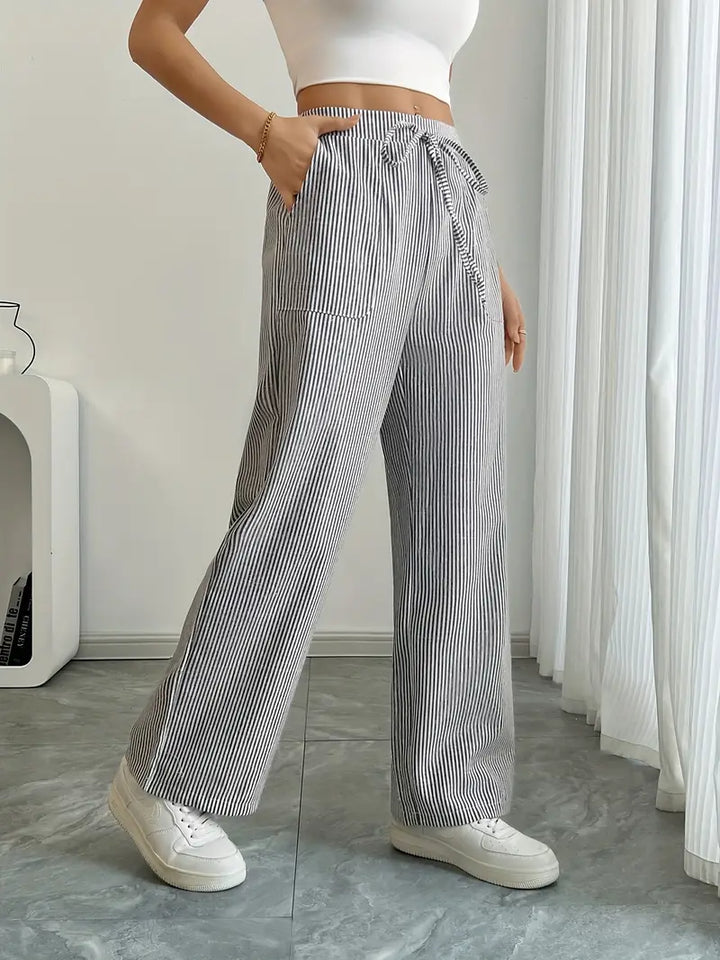 Women's fashion wide leg pants, elegant stripes, perfect for spring events.