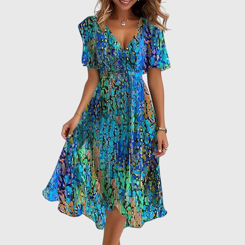 Elegant women's flowy chic midi dress with flutter sleeves, perfect for spring or summer occasions.