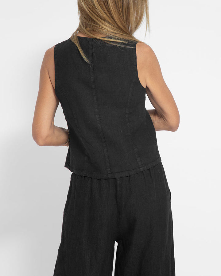 Front view: Women's fashionable two-piece set with wide leg trousers & elegant vest.