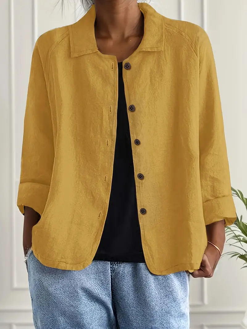 Sophisticated women's collared button-down blouse with three-quarter sleeves for transitional weather.
