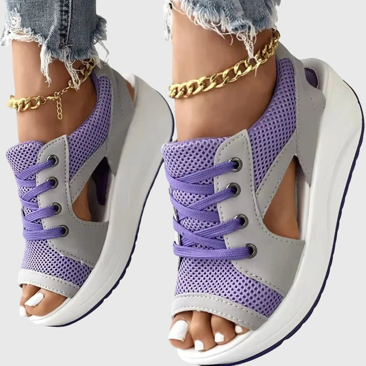 Comfy slip-on flat sandals for women, ideal for summer vacations & beach trips. Stylish open-toe design.