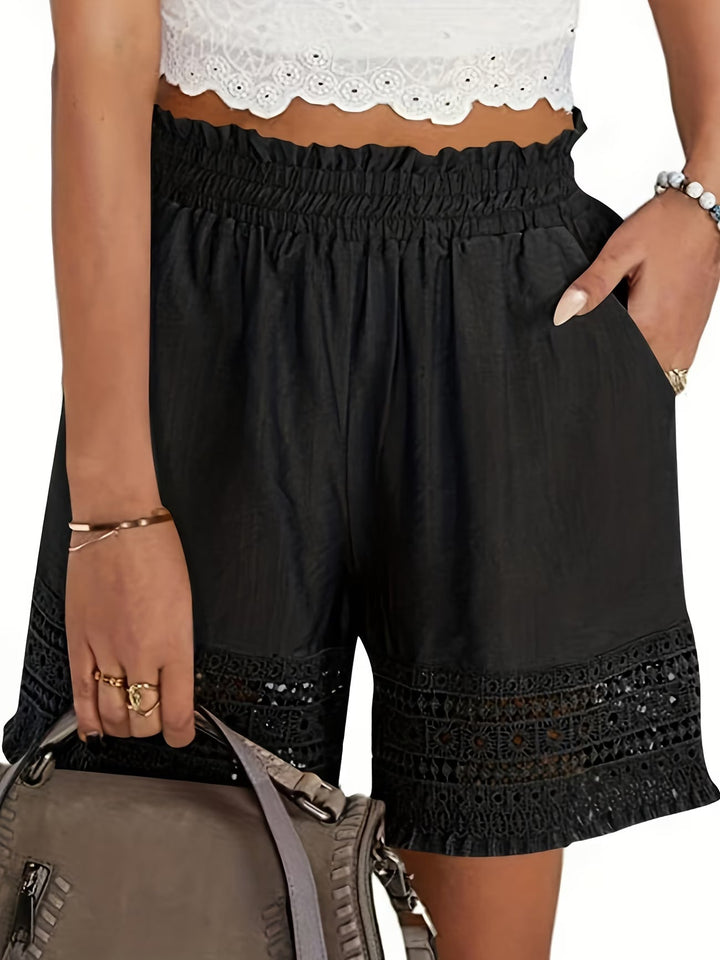 Chic women's tailored shorts with delicate lace trim & slant pockets, ideal for versatile summer fashion.