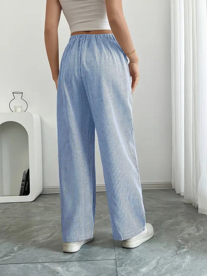 Stylish women's wide leg pants, blue stripes, drawstring, side pockets.