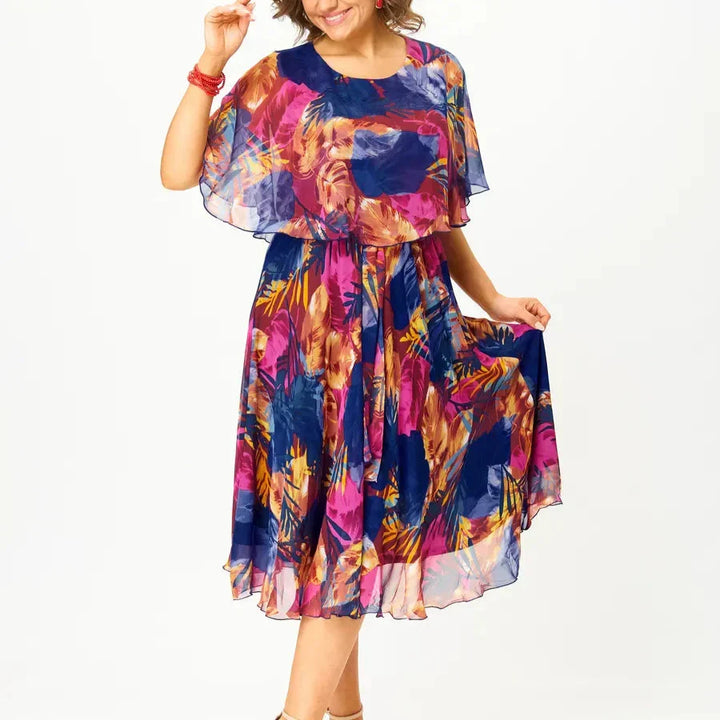 Comfortable plus size women's A-line midi dress, vibrant print, perfect flowing style for summer casual or party.