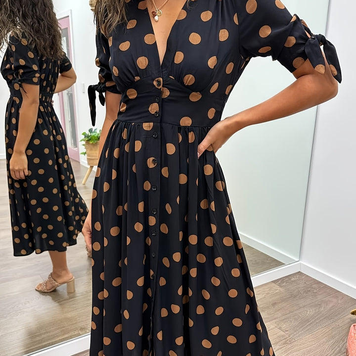 Women's versatile black polka dot midi dress. An elegant summer dress with v-neck and tie sleeves for any event.